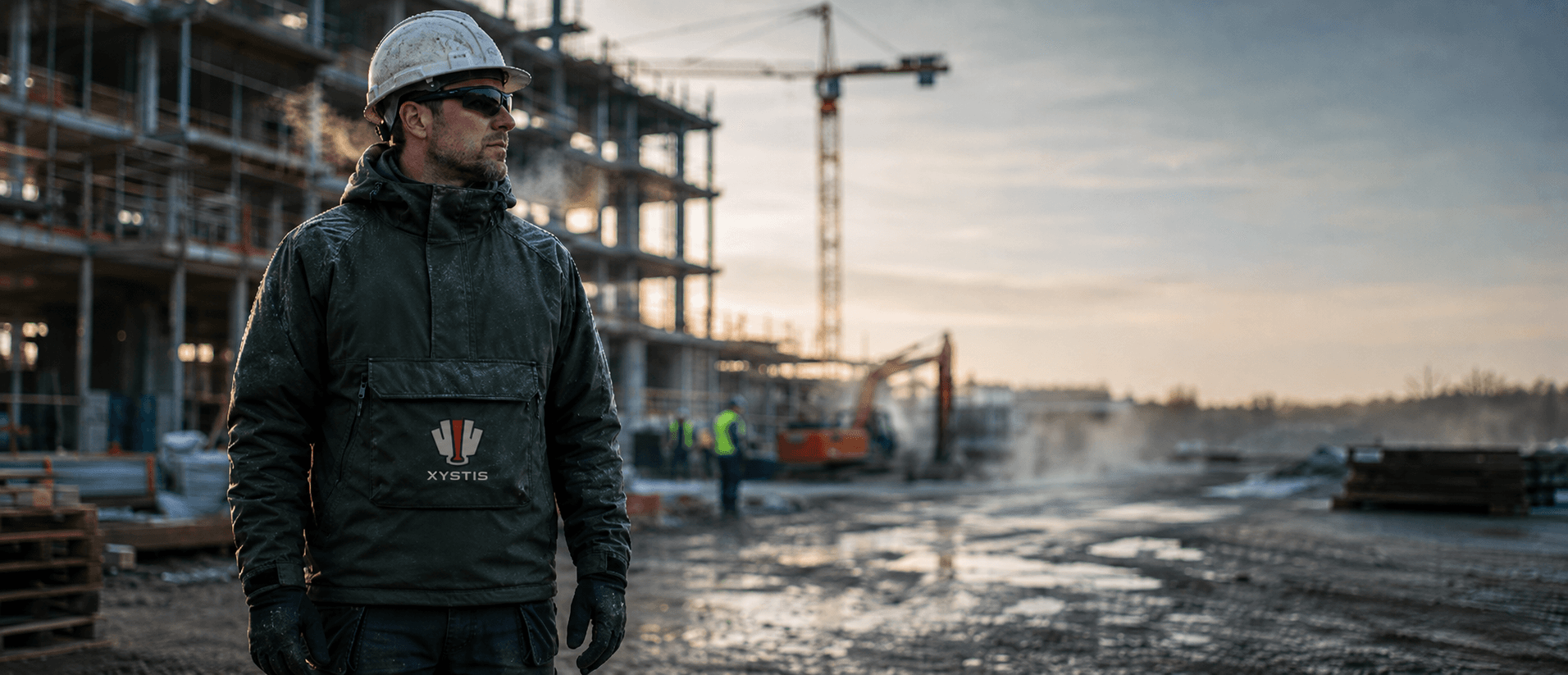 Xystis — construction worker wearing the heated jacket on a cold winter jobsite